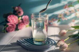 a glass with water and flowers