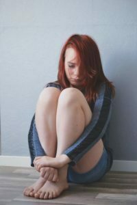 a woman sitting on the floor